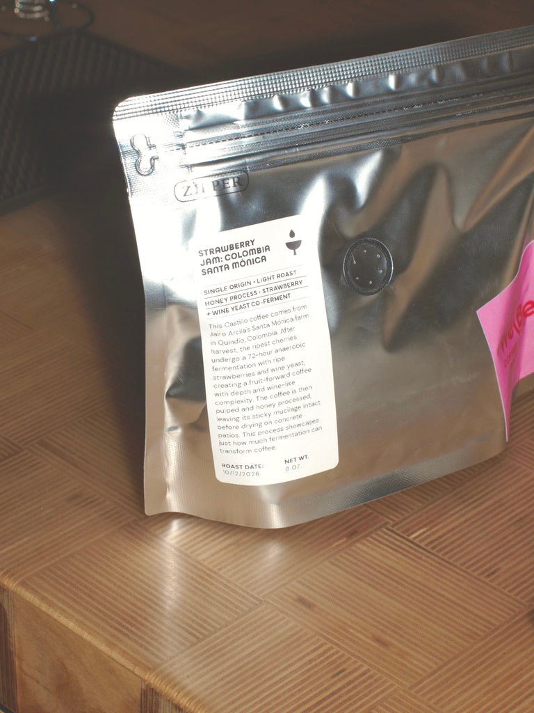 
                  
                    Back label of the Strawberry Jam Colombia Santa Mónica bag by WeBe Coffee Roasters: single origin, light roast, honey process, strawberry and wine yeast co-ferment, 8 oz.
                  
                